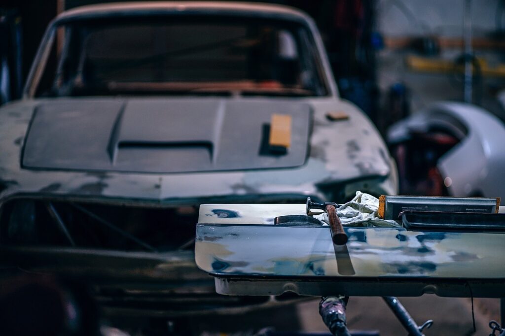 A car undergoing repairs in a garage, highlighting collision repair services in Melbourne.